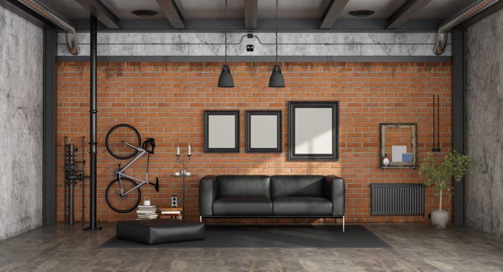 Salon dans un loft avec canapé noir contre mur de briques - rendu 3d